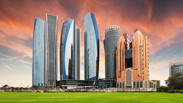 Skyscrapers in Abu Dhabi at dramatic sunset; United Arab Emirates