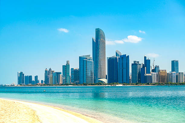 Abu Dhabi, panoramic view with sea and skyscrapers during sunny day