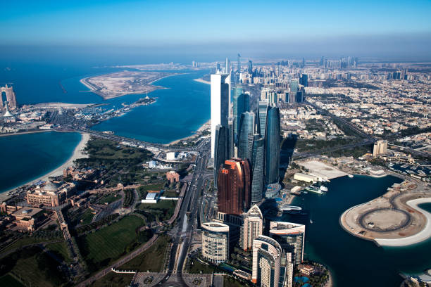 Helicopter point of view of Abu Dhabi skyscrapers and famous Emirates Palace Hotel.